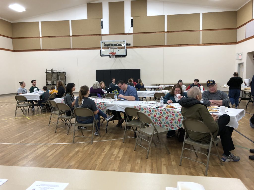 Attendees enjoying dinner - Housing Services Mid Michigan